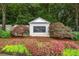 Elegant Legacy community entrance with beautiful landscaping and manicured flower beds at 1235 Renaissance Se Ct, Mableton, GA 30126