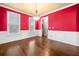 Bright dining room with hardwood floors, large windows, and stylish lighting at 1235 Renaissance Se Ct, Mableton, GA 30126