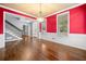 Elegant dining room with hardwood floors and views into the foyer at 1235 Renaissance Se Ct, Mableton, GA 30126