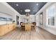 Elegant dining room with stylish light fixture, natural light, and modern decor, perfect for gatherings at 1235 Renaissance Se Ct, Mableton, GA 30126
