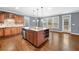 Gourmet kitchen with a large island, custom cabinetry, and stainless steel appliances at 1235 Renaissance Se Ct, Mableton, GA 30126