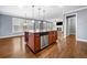 Spacious kitchen featuring a large center island, stainless steel appliances, and hardwood floors at 1235 Renaissance Se Ct, Mableton, GA 30126