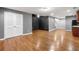 Spacious living room features hardwood floors and neutral color palette with direct access to upstairs staircase at 1235 Renaissance Se Ct, Mableton, GA 30126