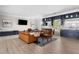 Spacious lounge area with stylish seating, built-in shelving, and contemporary decor, ideal for entertaining at 1235 Renaissance Se Ct, Mableton, GA 30126