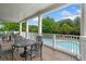 Covered patio with outdoor seating overlooking a sparkling pool, ideal for relaxation and entertaining at 1235 Renaissance Se Ct, Mableton, GA 30126