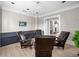 Comfortable sitting area with cozy chairs and access to other rooms, perfect for relaxation and conversation at 1235 Renaissance Se Ct, Mableton, GA 30126