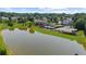Enjoy a picturesque view of the community pond with amenities, including a swimming pool and tennis courts at 3559 Reservoir Pass, Acworth, GA 30101