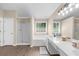 Bright bathroom featuring a shower, soaking tub, large vanity, and wood look floors at 3559 Reservoir Pass, Acworth, GA 30101