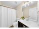 Bright bathroom featuring a shower with curtain, toilet, vanity, and modern light fixture at 3559 Reservoir Pass, Acworth, GA 30101