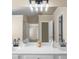 Bright bathroom featuring double vanity with black faucets and modern light fixture at 3559 Reservoir Pass, Acworth, GA 30101