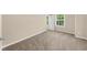 Carpeted bedroom with natural light, window with blinds, and neutral wall color at 3559 Reservoir Pass, Acworth, GA 30101