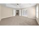 Large bedroom featuring neutral walls, carpet floors, a ceiling fan, and access to other rooms through doors at 3559 Reservoir Pass, Acworth, GA 30101