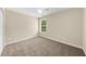 Bright bedroom featuring neutral walls, carpet floors, ceiling fan, and natural light from a window at 3559 Reservoir Pass, Acworth, GA 30101