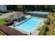 Large community pool with clubhouse, lounge chairs, and tennis court, perfect for recreation and relaxation at 3559 Reservoir Pass, Acworth, GA 30101