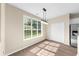 Bright dining area features modern lighting, wood floors, and large windows overlooking the yard at 3559 Reservoir Pass, Acworth, GA 30101
