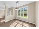 Bright dining room with wood floors, large window, and modern chandelier at 3559 Reservoir Pass, Acworth, GA 30101