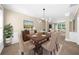 Elegant dining room with a modern chandelier, wood table, and stylish decor at 3559 Reservoir Pass, Acworth, GA 30101