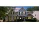 Beautiful two-story home with a combination of stone and siding exterior under a lovely evening sky at 3559 Reservoir Pass, Acworth, GA 30101