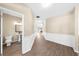 Neutral hallway showcasing wood floors, paneled walls and a conveniently located powder room at 3559 Reservoir Pass, Acworth, GA 30101