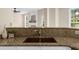 Kitchen area with granite counters and a view into a large living area at 3559 Reservoir Pass, Acworth, GA 30101