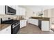 Well-equipped kitchen with white cabinets, granite countertops, and stainless steel appliances at 3559 Reservoir Pass, Acworth, GA 30101