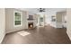 Open living room featuring a fireplace, a door to the outside, and modern wood floors at 3559 Reservoir Pass, Acworth, GA 30101