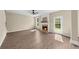 Spacious living room with a fireplace, a door to the outside, and neutral color palette at 3559 Reservoir Pass, Acworth, GA 30101