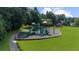 This community playground offers slides, swings, and climbing areas, surrounded by lush green lawns and mature trees at 3559 Reservoir Pass, Acworth, GA 30101