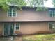 Back exterior of a house with siding and sliding glass doors at 5035 Chadwick Ct, Decatur, GA 30035
