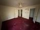 Interior view of an empty bedroom with three doorways at 5035 Chadwick Ct, Decatur, GA 30035