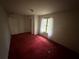 A bedroom with a window and doorway at 5035 Chadwick Ct, Decatur, GA 30035