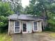 Close up of the front of a house with a stone facade and two entry doors at 5035 Chadwick Ct, Decatur, GA 30035