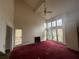 Bright living room with fireplace, large windows, and high ceilings at 5035 Chadwick Ct, Decatur, GA 30035