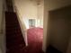 View of living room featuring carpeted staircase at 5035 Chadwick Ct, Decatur, GA 30035