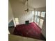 Spacious living room with high ceilings, fireplace, large windows, and a ceiling fan at 5035 Chadwick Ct, Decatur, GA 30035