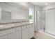 A bathroom with double sinks, granite countertops and a walk in shower at 504 Oak View Ln, Dallas, GA 30157