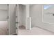 A hallway with carpeted floors and a walk in closet at 504 Oak View Ln, Dallas, GA 30157