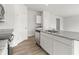 Open kitchen featuring white cabinets, stainless steel appliances, and a granite countertop island with double sinks at 504 Oak View Ln, Dallas, GA 30157