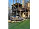 Outdoor living space with covered deck, patio with comfortable seating, and well-manicured landscaping at 5930 Shannon Drive Dr, Cumming, GA 30040
