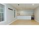 Spacious basement bar area with white cabinets, wood countertop, and large windows at 5930 Shannon Drive Dr, Cumming, GA 30040