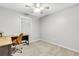 Bright bedroom with a ceiling fan, carpeted floor, and space for a desk at 5930 Shannon Drive Dr, Cumming, GA 30040