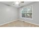 Neutral bedroom with a ceiling fan, carpet, and a window with lots of natural light at 5930 Shannon Drive Dr, Cumming, GA 30040