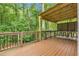 Inviting wood deck featuring an outdoor kitchen with barstool seating at 5930 Shannon Drive Dr, Cumming, GA 30040