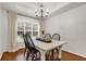 Cozy dining room with natural light and a classic chandelier at 5930 Shannon Drive Dr, Cumming, GA 30040