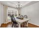 Traditional dining room with hardwood floors and modern chandelier at 5930 Shannon Drive Dr, Cumming, GA 30040