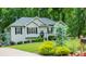 Charming single-Gathering home with well-manicured front yard and mature trees offering privacy at 5930 Shannon Drive Dr, Cumming, GA 30040