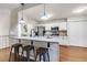 Kitchen featuring granite countertops, stainless steel appliances, and modern bar seating at 5930 Shannon Drive Dr, Cumming, GA 30040