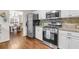 Well-equipped kitchen with stainless steel appliances and granite countertops at 5930 Shannon Drive Dr, Cumming, GA 30040