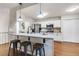 Modern kitchen with stainless steel appliances, granite countertops, and bar seating at 5930 Shannon Drive Dr, Cumming, GA 30040