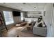 Spacious living room features modern lighting, a comfortable couch, and an entertainment center at 5930 Shannon Drive Dr, Cumming, GA 30040